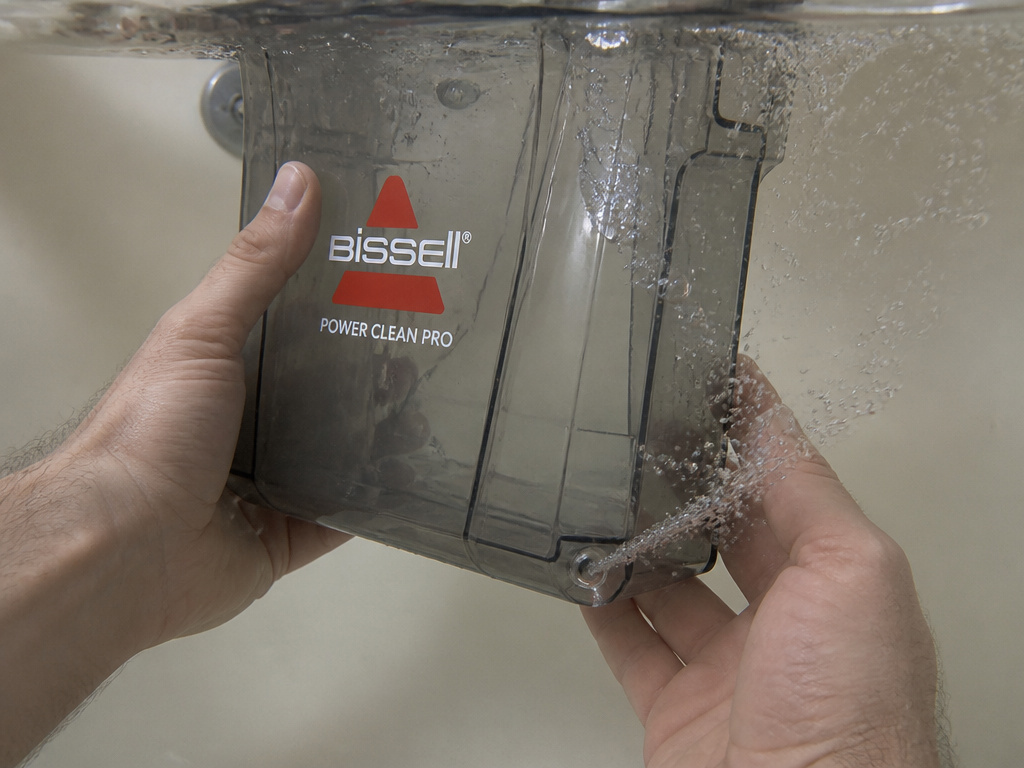 Bissell PowerClean Pro tank leak test showing bubbles from a crack underwater.